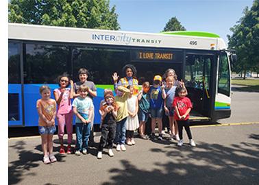 Students and Teacher standing outside an Intercity Transit bus