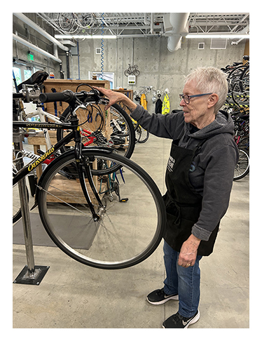 Volunteer in the Walk N Roll bike shop