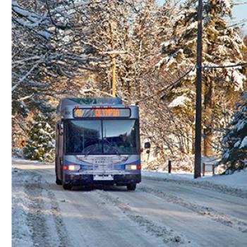 A bus driving in the snow