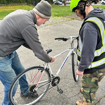 A Full Cycle recipient receiving their new bike