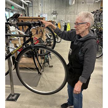 Volunteer in the Walk N Roll bike shop