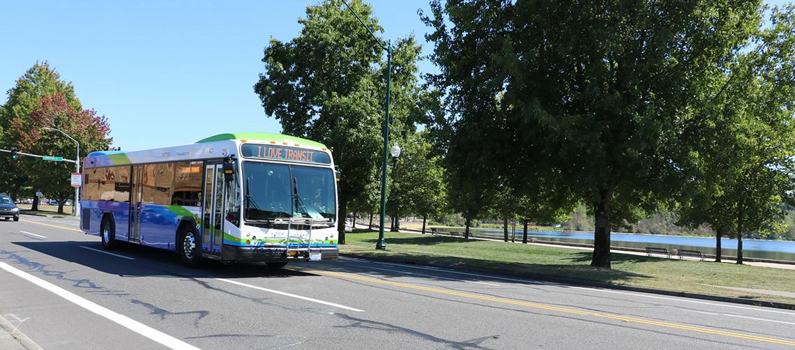 Intercity Transit bus in motion. Headsign says "I Love Transit"